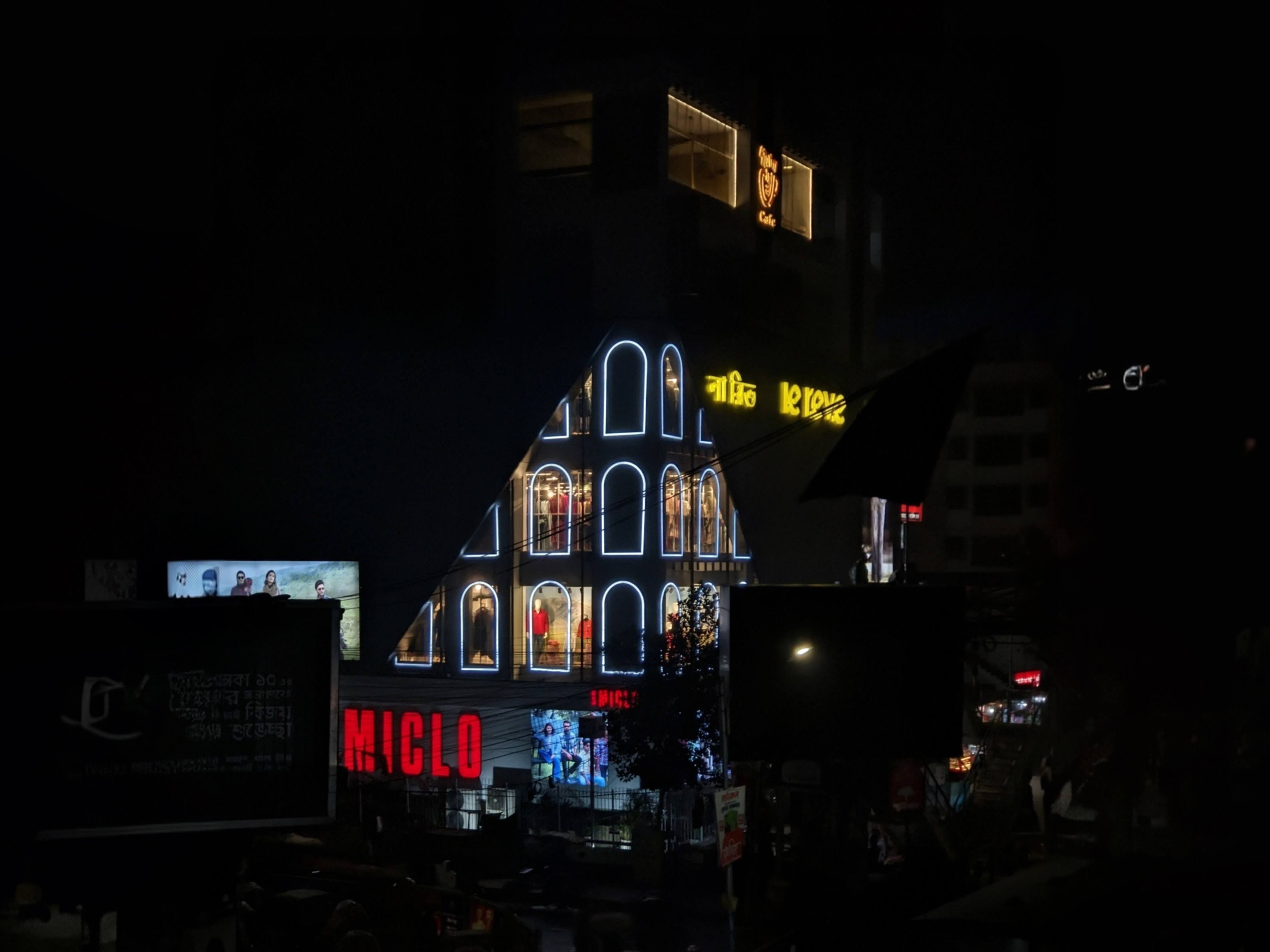 Neon-lit building facade with Miclo branding and modern architecture by miqdad23.