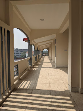Perspective view of an arched corridor with long dramatic shadows by miqdad23.
